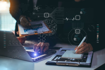 Double exposure of Businessman using digital technological interface with icons.