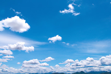 Clouds patterns on  bright blue sky background  with light wind in summer day