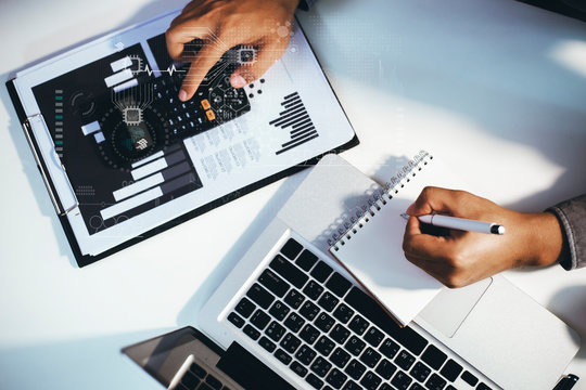 Double exposure. Business documents  at the office desk. Global Strategy Virtual Icon.Innovation Graphs Interfaces. Workplace strategy concept.