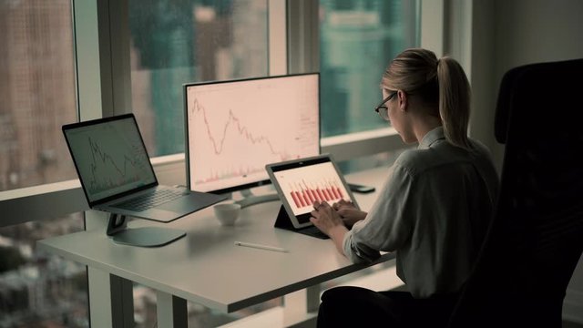 Caucasian marketer making online browsing for analyze investment deposit of virtual money - bitcoin using infographics from financial websites, skilled proud ceo checking trade volatility