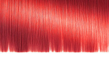 Red hair close-up on white background, isolated. Carefully trimmed tips