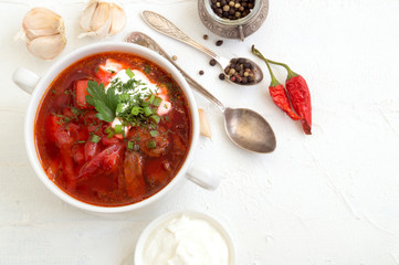 traditional Ukrainian Russian soup (borscht) from beet with greens and sour cream.