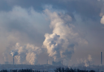 Smoke from the chimneys of a metallurgical plant at dawn