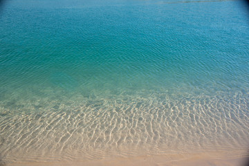 Fototapeta na wymiar clean blue water from shallow to deep