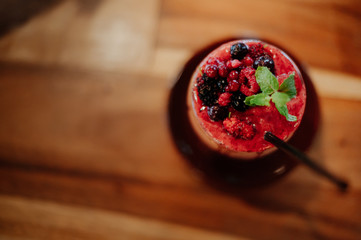 Obraz na płótnie Canvas Berry smoothies, decorated with berries