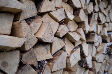 Woodpile with fireplace wood stacked. alternative, renewable energy