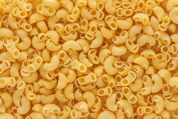 Dried uncooked macaroni little noodle above view macro