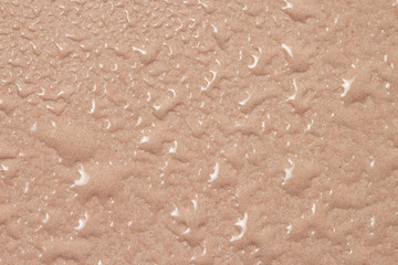 Raindrops pink surface water background