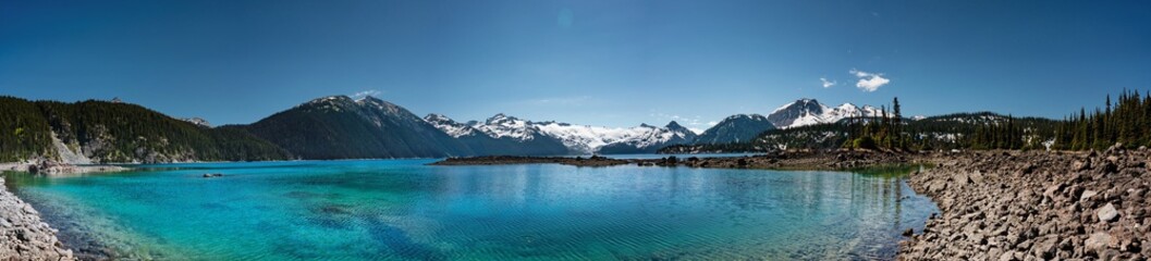 Panoramic view of mountains and turquoise coloured lake in Garibaldi provincial park, BC, Canada