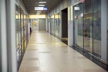 Interior concept of a modern urban shopping center. Photo of a shopping range inside a store.