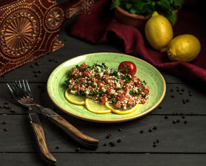 mediterranean parsley salad, made with fresh tomatoes and hemp seeds