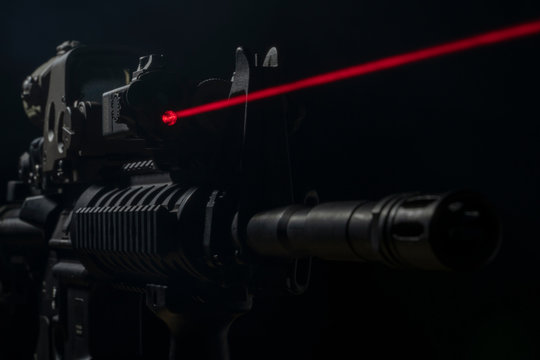 Optical sight and laser device with a red beam on the M4 rifle
