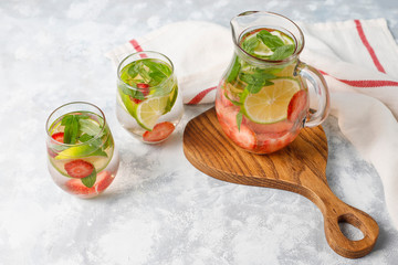 Fresh lime,strawberry and mint infused water, cocktail, detox drink, lemonade. Summer drinks. Health care concept.