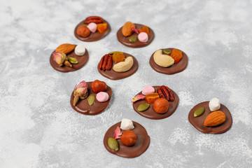 Handmade chocolate mediants, cookies, bites, candies,nuts. Copy space. Top view.