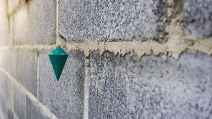 The construction of a plumb using a right angle measurement
