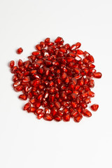 Grain pomegranate on a white background, beautiful texture.