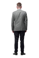 rear view. confident businessman looking at copy space. isolated on white