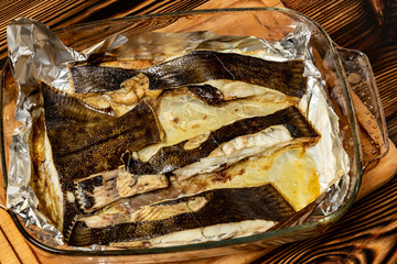 Baked flounder in aluminum foil.