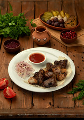 lamb kebab served with onion and sumac blend, tomato and herbs sauce
