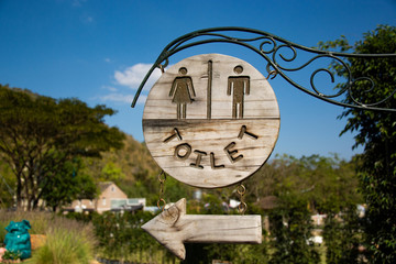 Male and female toilet signs invite on the left.