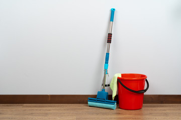 Fototapeta premium Cleaning tools for house cleaning on wooden floor