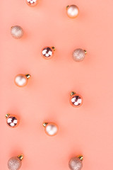 Beautiful Christmas holiday decorations in contemporary trendy orange colors on coral background. Flat lay, copy space, top view. Winter holidays, New Year. Merry Christmas card. Horizontal 