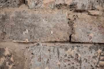 dirty gray brick. to spackle a wall. the texture of the old grey brick