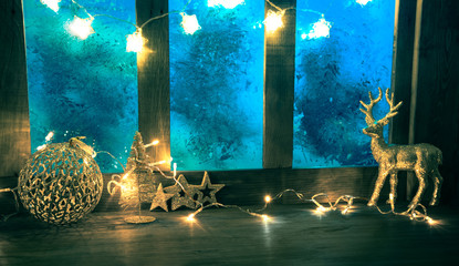 christmas cozy interior background with window sill illuminated with lights
