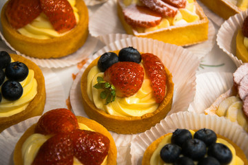 cakes with cream strawberry and blueberry