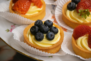 cakes with cream strawberry and blueberry