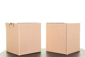 Two brown cardboard carton parcels corrugated