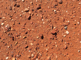 Fototapeta na wymiar Red dirt and stones from the outback, texture