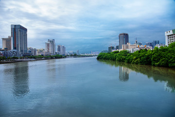 Fototapeta na wymiar Sanya Cityscape Blue River and Clouds View
