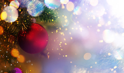 Christmas and New Year holidays background. Glitter lights backdrop. Winter season. Text space. Closeup of Christmas-tree.