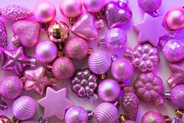 Christmas decoration balls different shapes in neon rays. Top view. Xmas pattern. Happy New Year.