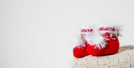 Beautiful red booties for baby. Knitting for children.