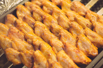 Chicken kebab in the kitchen of an oriental restaurant. Kebab with chicken wings. Oriental and Muslim Street Food