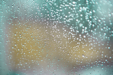 Blurred background of drops on the window. Abstract background.