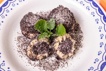 sweet dumplings with poppy seeds and icing sugar