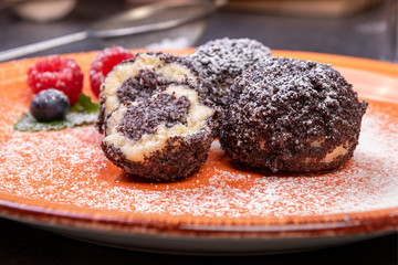 sweet dumplings with poppy seeds and icing sugar