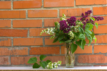  Beautiful floral  syringa pattern. Brick wall background. Wedding invitation or Mother's Day  brick background, empty space surrounded with flowers