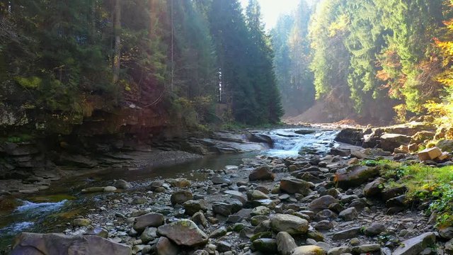mountain river flowing between rocky shores in Carpathians mountains, Ukraine