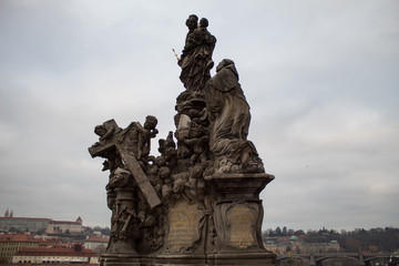 Fototapeta na wymiar A masterpiece of architecture the famous Charles Bridge in the city of Prague, Czech Republic, on a cloudy morning on the eve of Christmas.