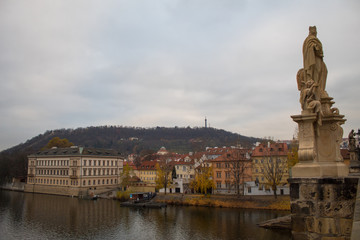 Fototapeta na wymiar A masterpiece of architecture the famous Charles Bridge in the city of Prague, Czech Republic, on a cloudy morning on the eve of Christmas.