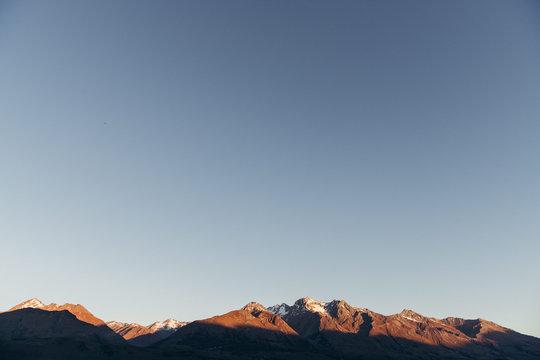 Sun setting on mountains
