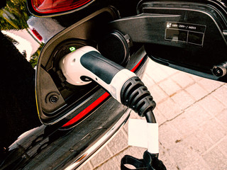 EV Car or Electric car charging at charging station
