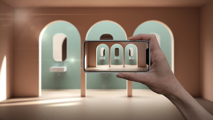 Hand holding smart phone, AR application, simulate furniture and interior design products in real home, architect designer concept, creative bathroom with sink and archways, archways