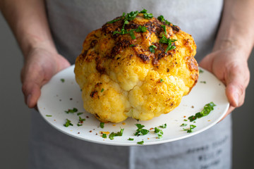 baked cauliflower with spices and herbs on a plate