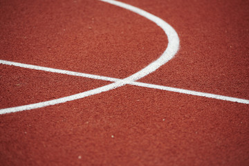 A basketball court section with white lines