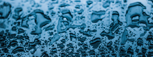 Water texture abstract background, aqua drops on blue glass as science macro element, rainy weather...
